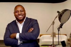 Jon Gosier seated for a studio portrait
