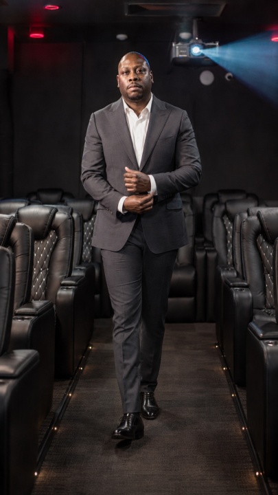 Jon Gosier walking through a private screening room