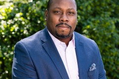 Jon Gosier in a blue blazer at his Atlanta home