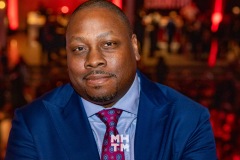 Jon Gosier at an entertainment industry event in a blue suit